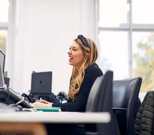 Woman smiling at office desk