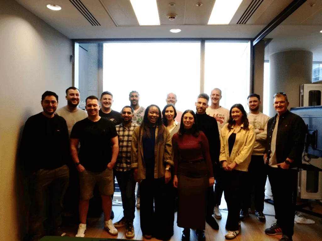 Team standing together in office
